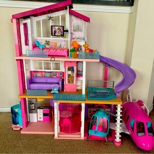 Barbie dream house, Airplane, helicopter, cars.